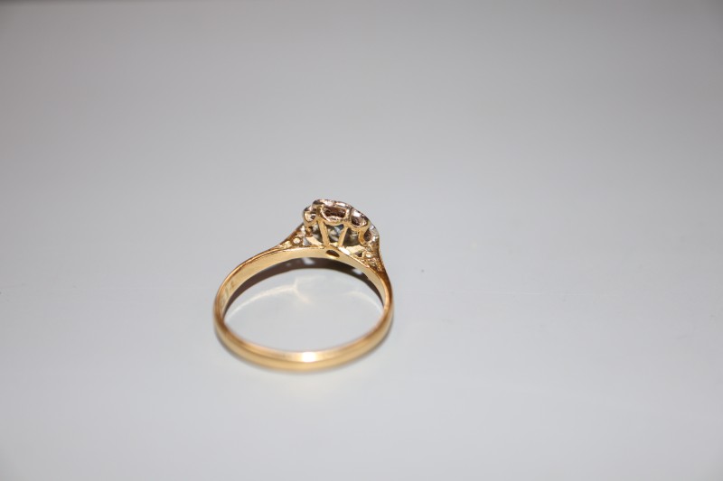 A modern 18ct gold and plat, sapphire and diamond oval cluster ring, size L, gross 2.6 grams.